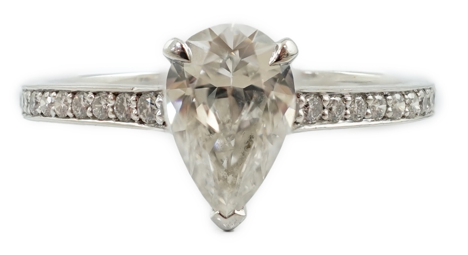 A recent Boodles platinum and single stone pear cut diamond set Harmony design ring, with diamond chip set shoulders and setting